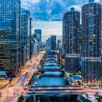 Black stretch limousine at night — USA city